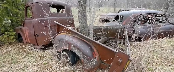 classic cars on abandoned farm in Canada