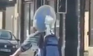 AC on the Go: Cyclist Keeps Cool With Electric Fan in Backpack