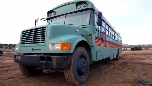 This school bus has been converted into an adobe-style house on wheels by a couple