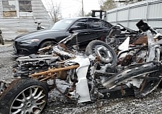 All That's Left of This Car Is a Pile of Metal and You're Supposed To Guess What It Was