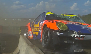 ALMS Series Porsche 911 Crashes Hard, Lands on Top of Tire Wall