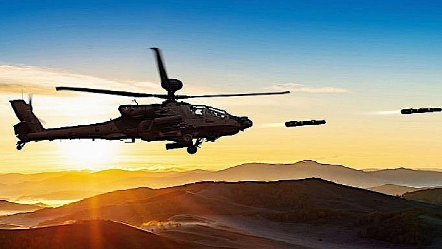 Attack helicopter firing JAGM missiles