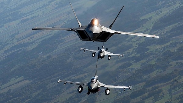 F-22 Raptor and F-16 Fighting Falcons flying over Poland