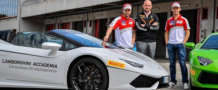 Andrea Dovizioso and Casey Stoner have fun with Lamborghini