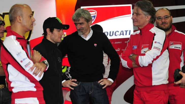 Gigi Dall' Igna, in the center of the image, with Cal Crutchlow
