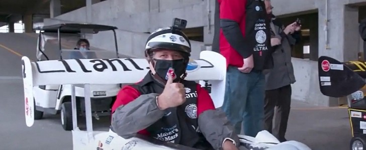 Michael Andretti shows thumbs up as he races to a Guinness World Record for driving the world's fastest edible car