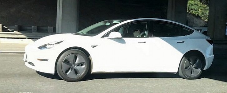 Driver sleeps at the wheel of his Tesla, in busy rush hour traffic in San Francisco