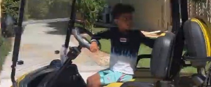 Antonio Brown's Son Ali Driving a Golf Cart