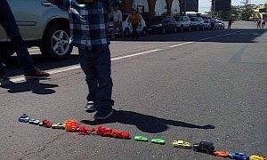 Armenian Boy Makes Road Blocks of Toy Cars in Country’s Capital