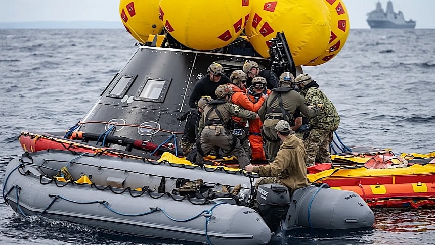 NASA and Navy people practicing Orion spacecraft recovery