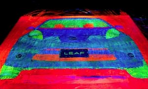 Artist Uses Tires of a Nissan Leaf to Paint an Upscaled Glowing EV