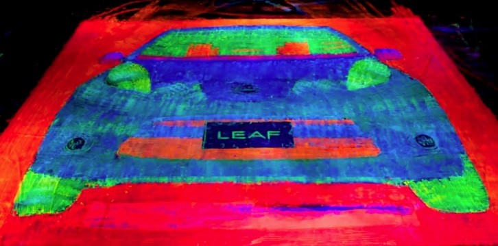 Artists Uses Tires of a Nissan Leaf to Paint an Upscaled Glowing EV