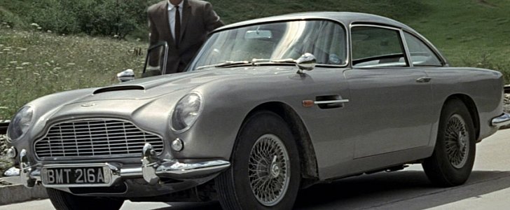 Sean Connery as James Bond, with his Aston Martin DB5 in Goldfinger