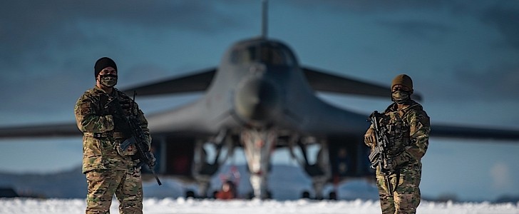 Two soldiers guard a B-1B Lancer in Norway
