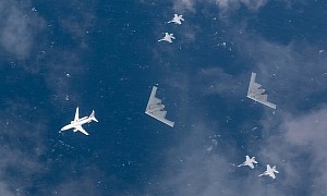 B-2 Spirits Look Like Captured Alien Spacecraft, Escorted by Human Fighter Jets