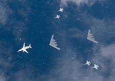 B-2 Spirits Look Like Captured Alien Spacecraft, Escorted by Human Fighter Jets