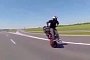 Backwards Wheeling While Standing on a Bike Looks Insanely Awesome