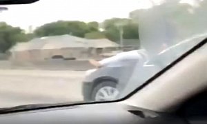 Barefoot Woman Rides on Hood of Speeding Car on Houston Highway
