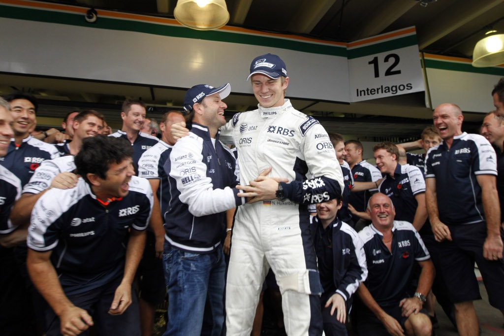 Rubens Barrichello and his much younger teammate Nico Hulkenberg celebrate pole position in Brazil