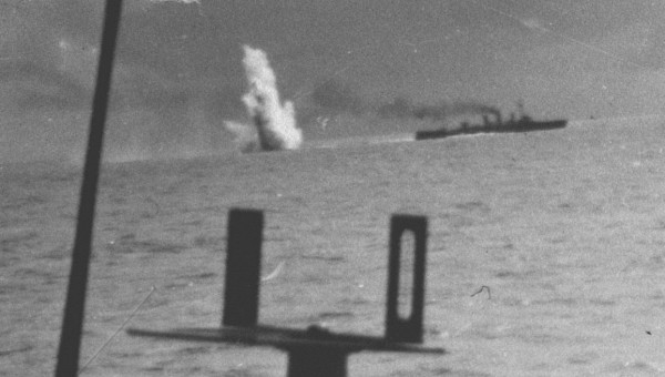 A depth charge explodes in a battle between a German submarine pack and an merchant ship convoy