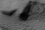 Big Nose and Half of a Face Seem to Be Lurking Underground in Creepy Photo of Mars