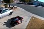 Biker Falls Down in the Driveway, Hilariously Struggles With Her Wheels