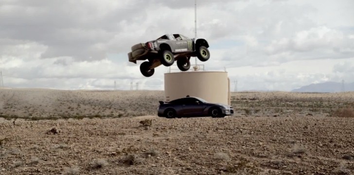 Baja truck jumping over Nissan GT-R