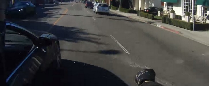 A BMW driver runs down a motorcyclist