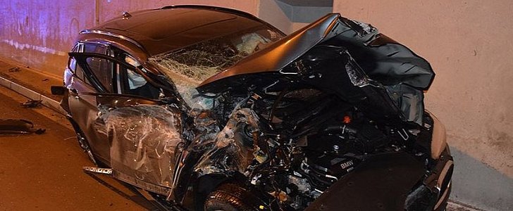 BMW totaled after it was sent flying off the road, hitting the ceiling of a tunnel