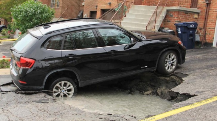 BMW X1 nearly swallowed by sinkhole