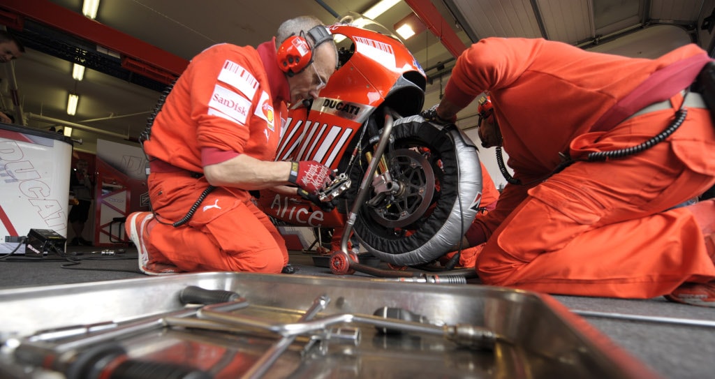 Ducati mechanics working on bike's setup