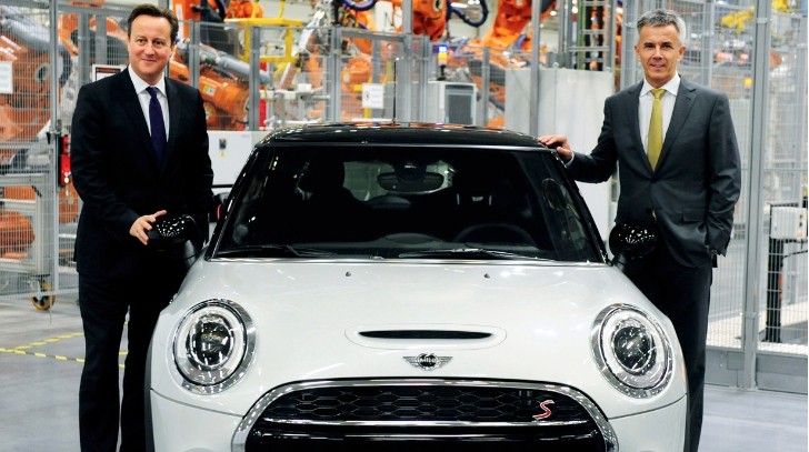 British Prime Minister David Cameron, right, with Peter Schwarzenbauer, BMW Group's board member for MINI, BMW 