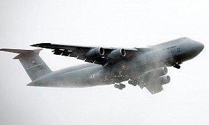 C-5M Super Galaxy Emerges From the Clouds Like a Prehistoric Behemoth