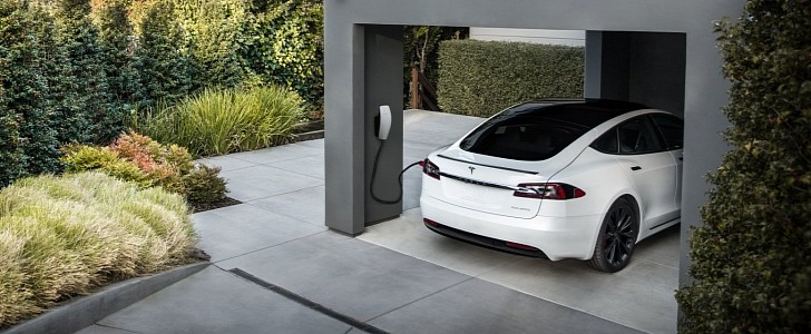 Tesla Model S charging at a home using the company's dedicated charging system
