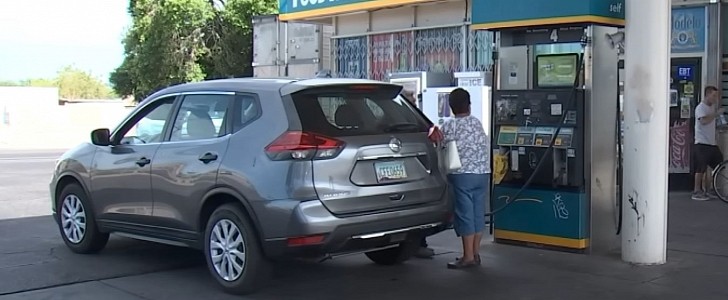 Woman Filling Up with Gas