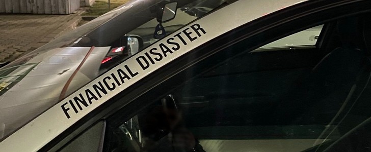 Financial disaster sticker on a car