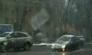 Car Biting Russian Pothole