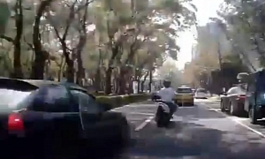 Car Chasing Scooter Crashes into Parked Vehicle