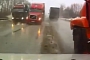 Car Gets Pinned Between Four 18-Wheelers in Russia!