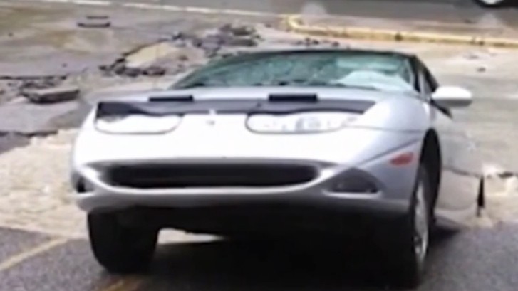 Car Is Swallowed By Sudden Sinkhole After Old Storm Drain Collapses