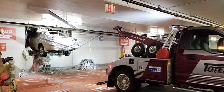 The car somehow made a hole in the Walmart store wall
