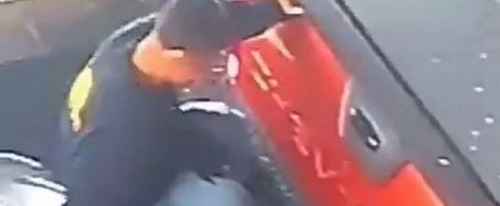 Car wash employee jumps between 2 cars to avoid crash on his first day of workl