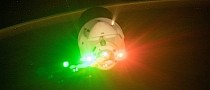 Cargo Dragon Lights Up in Red and Green as It Leaves the ISS