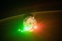 Cargo Dragon Lights Up in Red and Green as It Leaves the ISS