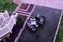 Caring Wife Tries To Move Husband’s Motorcycle, Fails Badly