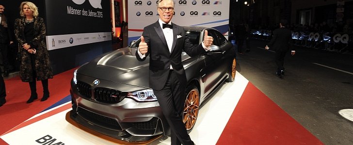 Tommy Hilfiger posing with the BMW M4 GTS