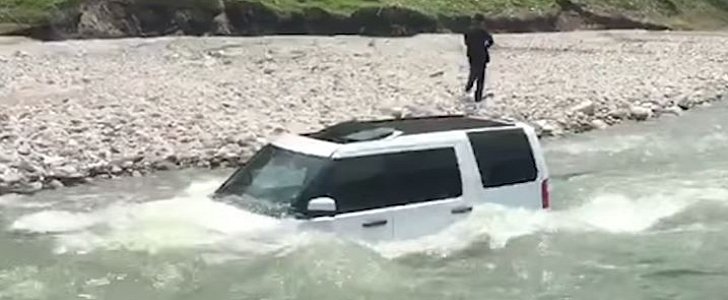 Man drives Land Rover into river to avoid paying $3 on car wash, gets stuck