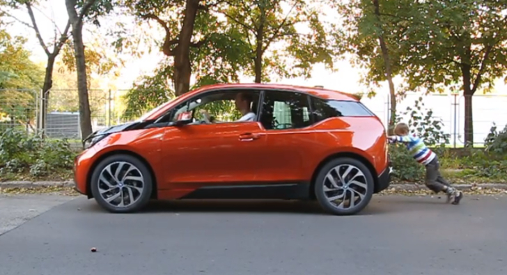 BMW i3 pushed by a 7-year old