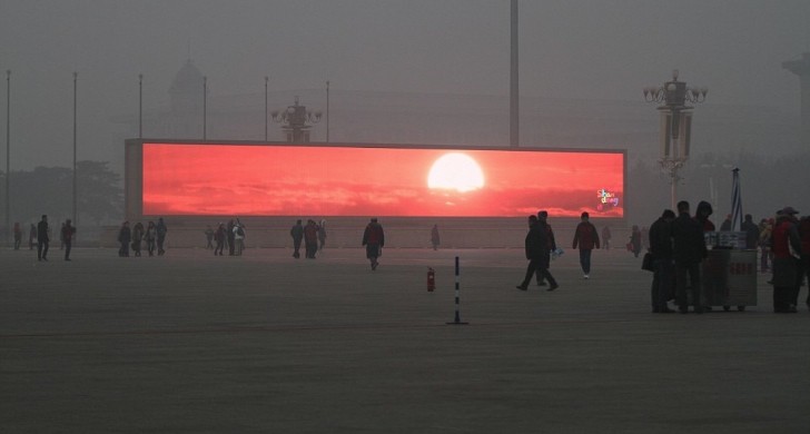 Digital commercial television screens playing an actual sunrise in Beijing