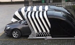 Chinese Company Invents Cocoon Garage That Wraps Around the Car